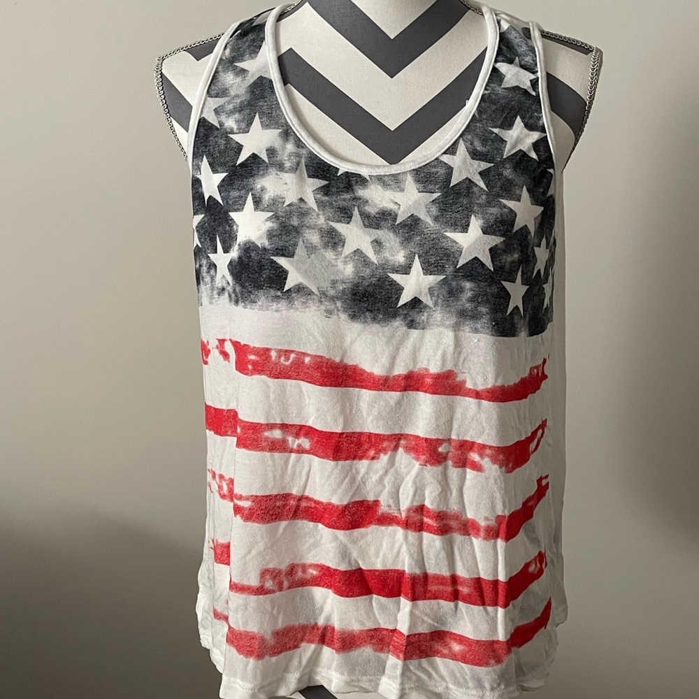 Tank top, sweater like.